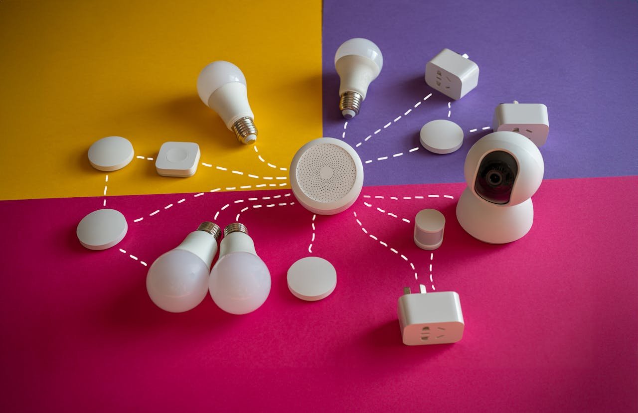 Smart home devices like bulbs and sockets connected on a vibrant backdrop.